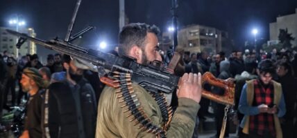 Assad supporters and Syrian army clashed, killing dozens, according to a monitor
